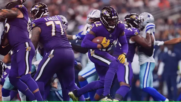 Baltimore Ravens hold the ball